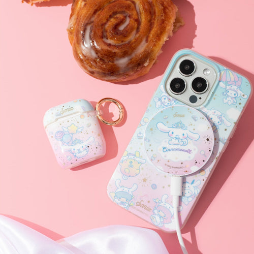 Pink and blue iphone case with gold stars, clouds, and hello kitty character cinnamoroll with matching airpods case and magsafe charger on the case with a pink background