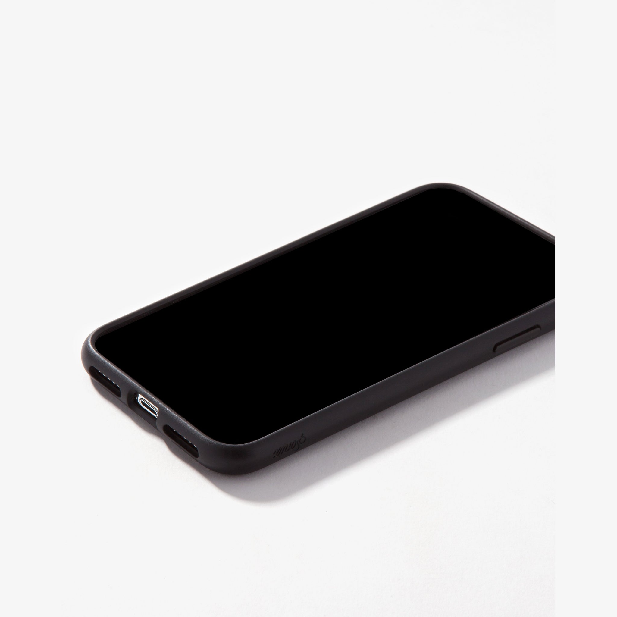 black case with white tort dice shown on an iphone 11 pro max front view