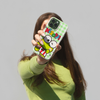 girl with brown hair in green sweater holding keroppi smiles magsafe compatible iphone case