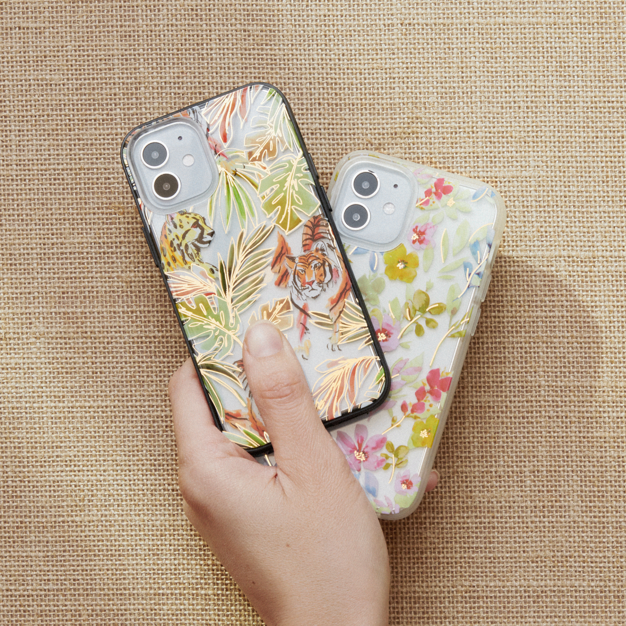 watercolor print of jungle cats with gold foil embroidered shown on an iphone