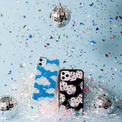 black case with white tort dice shown on an iphone with glitter confetti and disco balls in the background