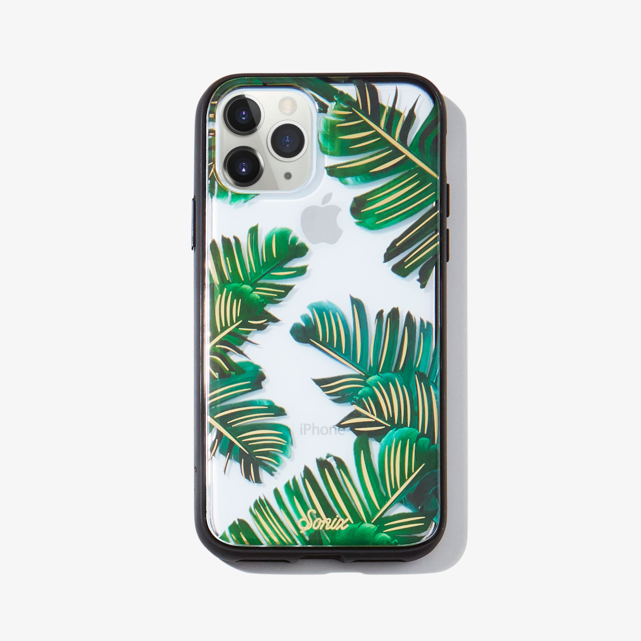 Bahama palm leaves iPhone 11 pro phone case on white phone.