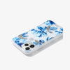 deep blue floral design with gold embroidered leaves shown on an iphone 11 pro side view