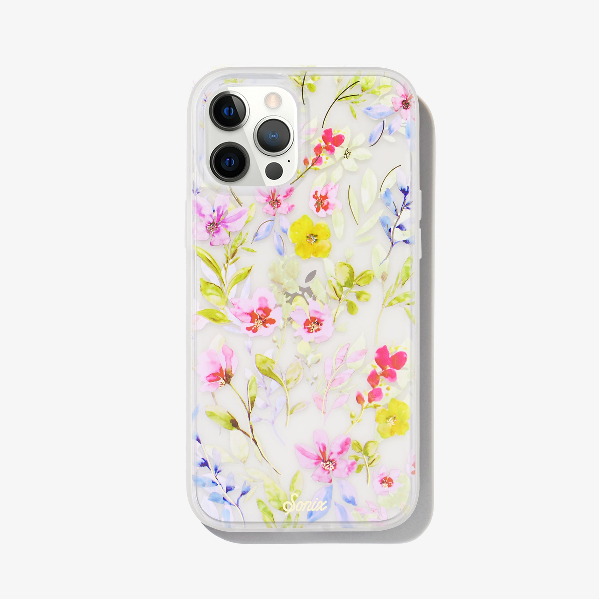 watercolor bouquets printed on a white iPhone 12 pro max iphone with hints of pink, purple, and blue accented with bright greenery. featuring Sonix gold logo at bottom. 